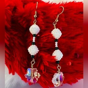 Crystal snowflake earring with white and green accents. $10